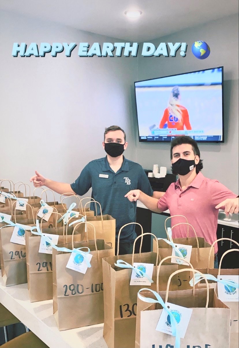 Two Men Handing Out Bags